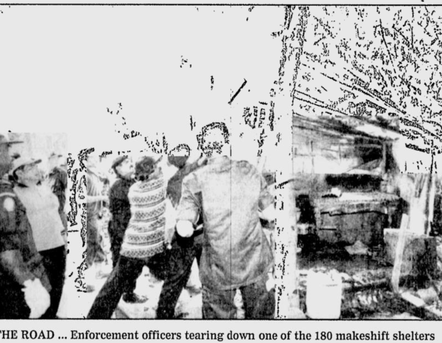 nst-20000216-limaumanis-officers-tearingdown.png