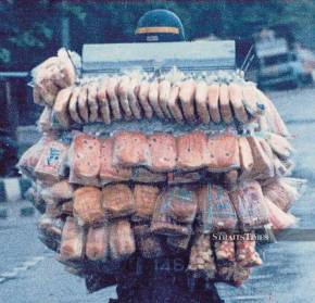 A modern-day ‘roti man’ making his rounds. The Roti Bhai man who visited the writer’s home rode a bicycle with a bamboo basket containing the bread. FILE PIC A modern-day ‘roti man’ making his rounds. The Roti Bhai man who visited the writer’s home rode a bicycle with a bamboo basket containing the bread. FILE PIC